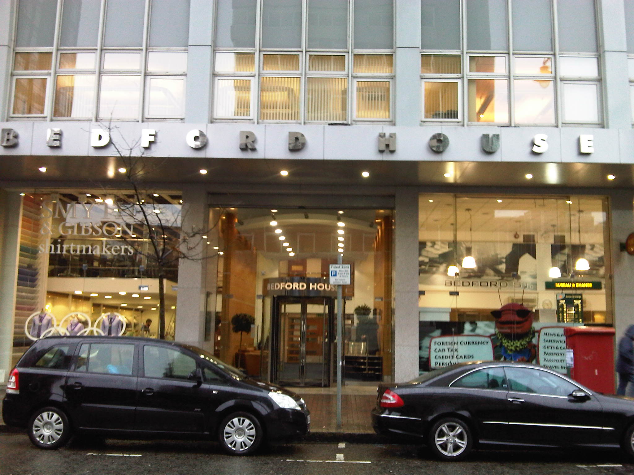 Bedford House building exterior with cars parked in front.