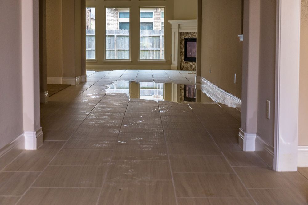 Interior Flooded With Water; Beige Tile Floor, Light Walls — Enviro Clean Carpet and Tile Cleaning in Terrigal, NSW
