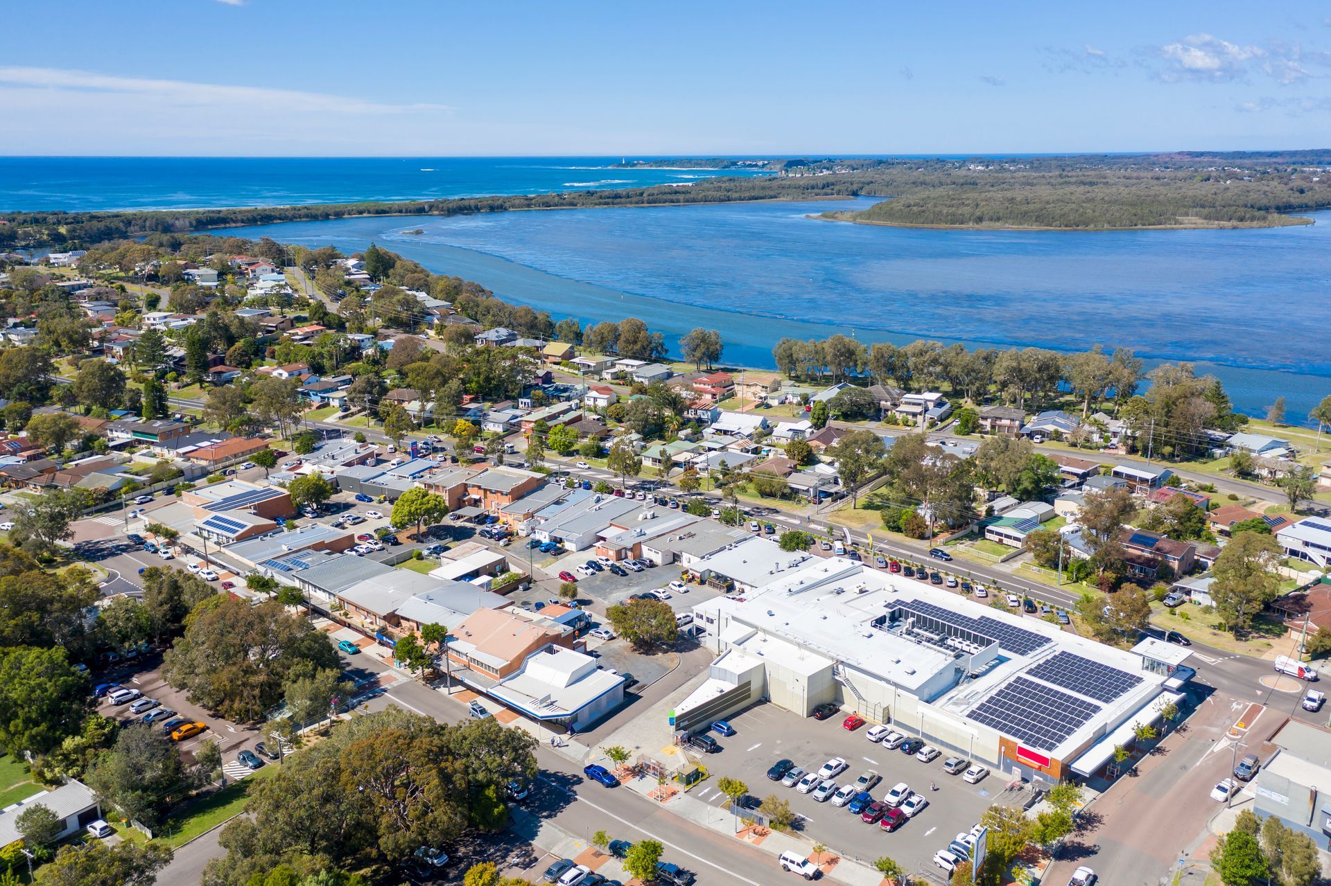 Aerial View of a Town by a Large Body of Water — Enviro Clean Carpet and Tile Cleaning in Budgewoi, NSW