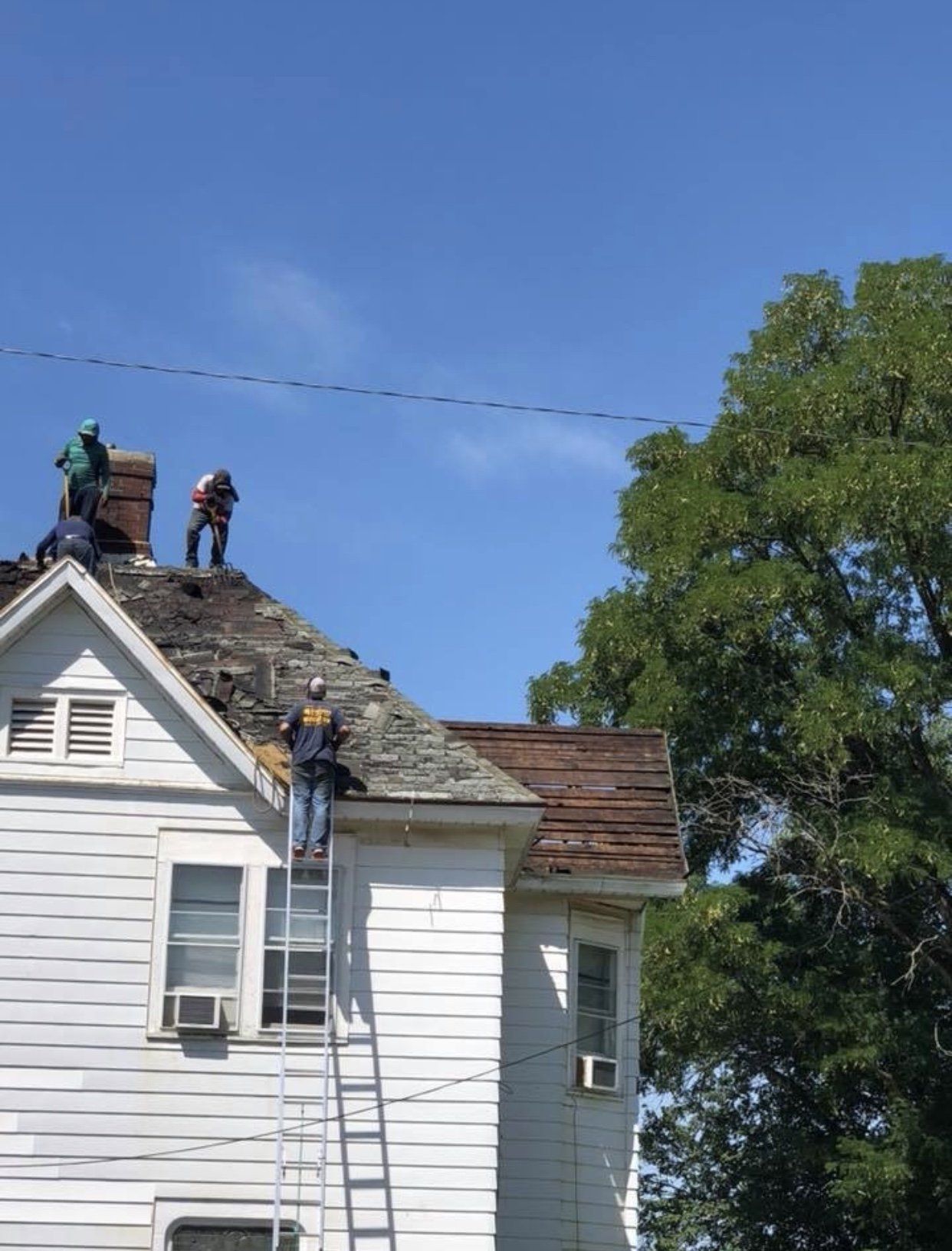 Roofers Repairing The Roof — Morris, IL — Shenberg Construction