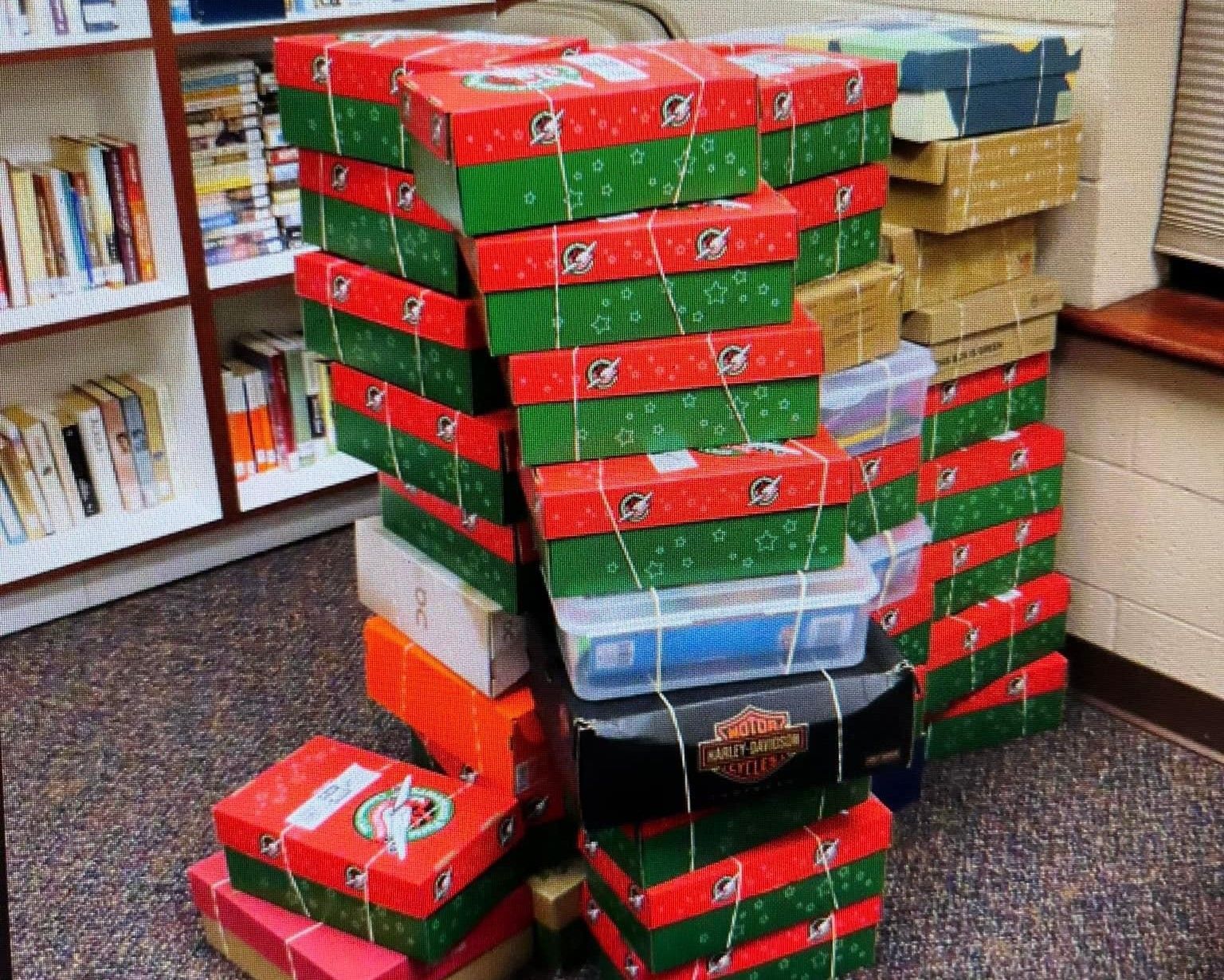 A stack of boxes with one that says harley davidson on it