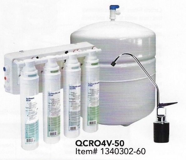 Four black industrial water filtration tanks standing side-by-side, each topped with a digital control valve.