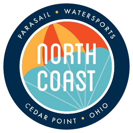 North Coast Parasail Watersports logo with blue ring, orange sun, and Cedar Point, Ohio text