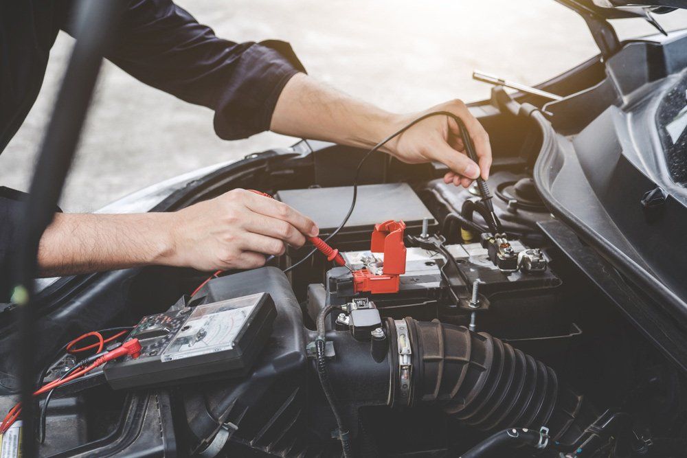 Automobile mechanic repairman hands checking a car engine — Mechanic Near Me in Muswellbrook, NSW