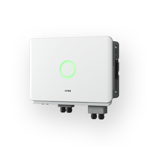 The SAJ R6 white solar inverter with a green light on the front, mounted on a gray surface.
