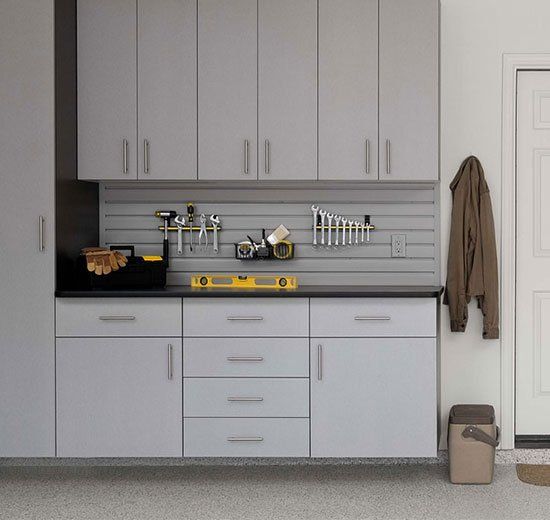A kitchen with a lot of cabinets and drawers
