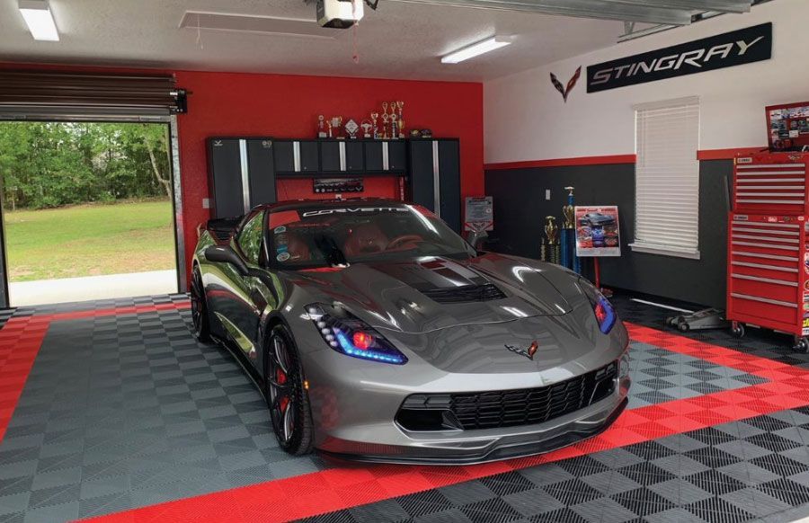 a garage with black, grey, and red swisstrax flooring