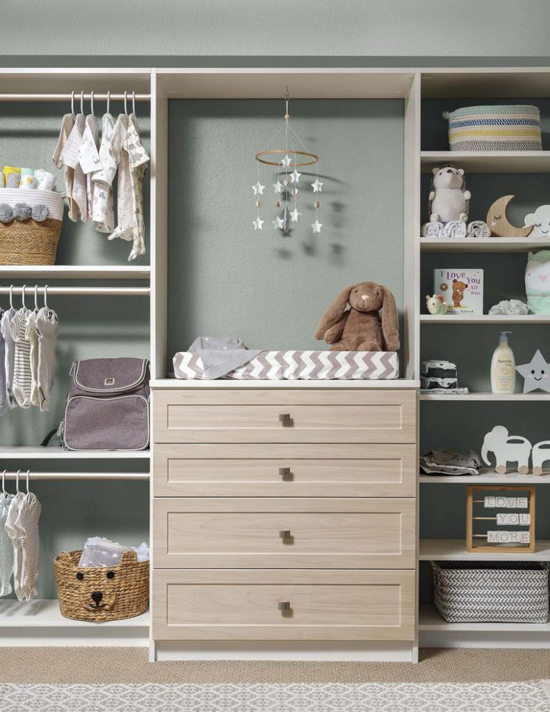 a child's custom closet system filled with toys and clothing