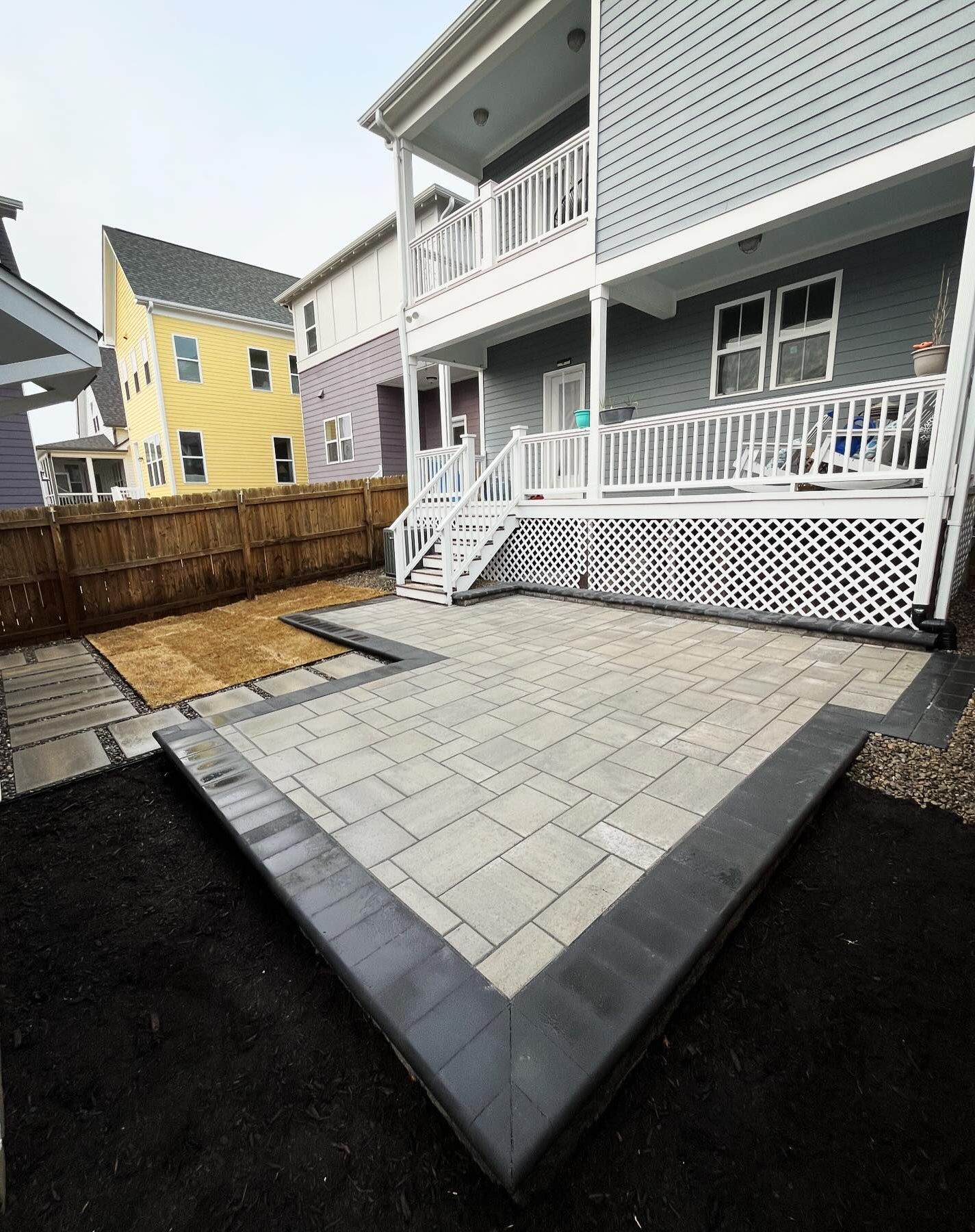 A large house with a patio in front of it