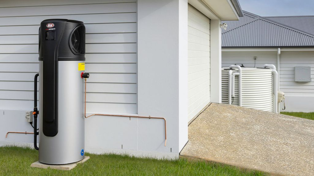 Water Heater Beside a House Wall, Next to a Driveway — Taree Hot Water in Taree, NSW