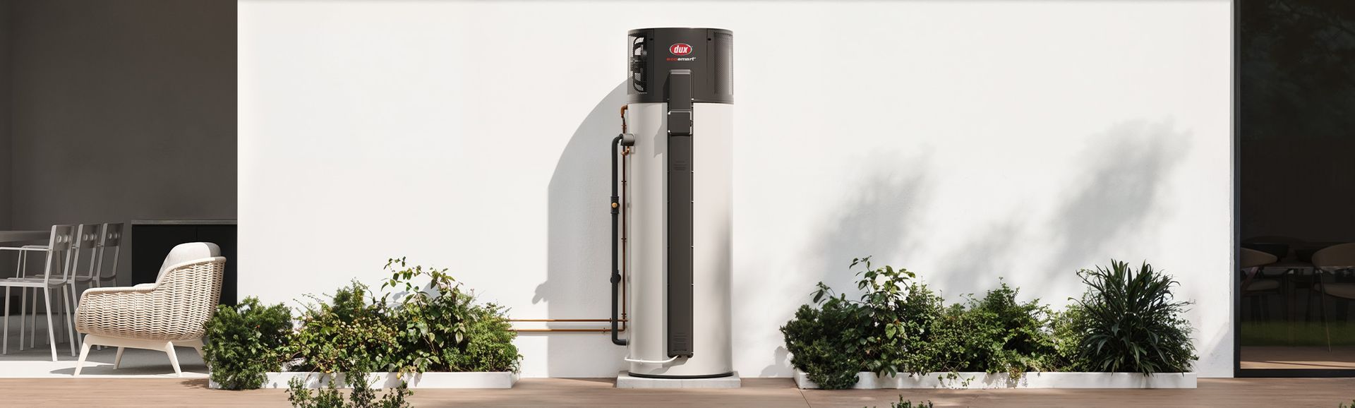 Outdoor Patio With a Tall Black Heater Beside White Walls — Taree Hot Water in Taree, NSW