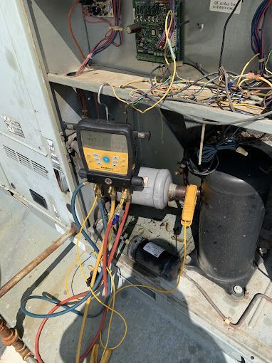 A bunch of wires are connected to a machine.