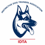 Distinctive Dog Trainers Association logo with blue dog head and red IDTA text