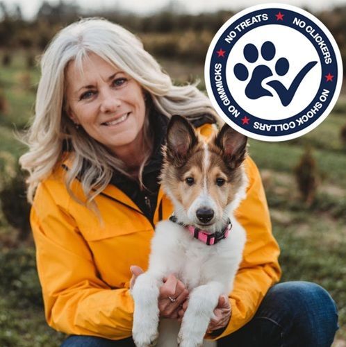 Woman in a yellow jacket crouches with a small dog outdoors; nonprofit logo appears in the corner