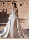 Model wearing an Blue By Enzoani wedding dress