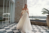 Model wearing an Alena Leena wedding dress