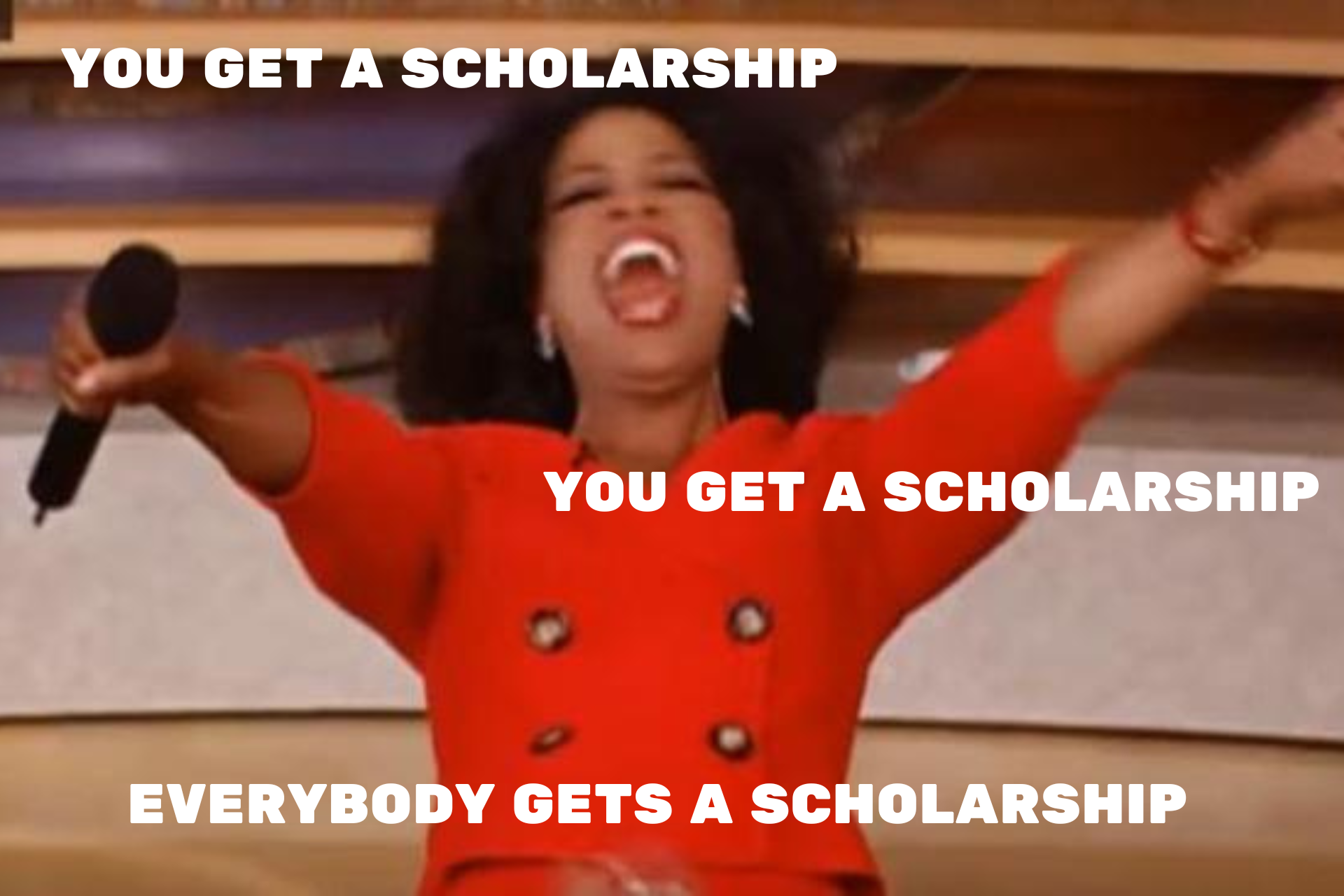 Oprah winfrey is holding a microphone with her arms in the air