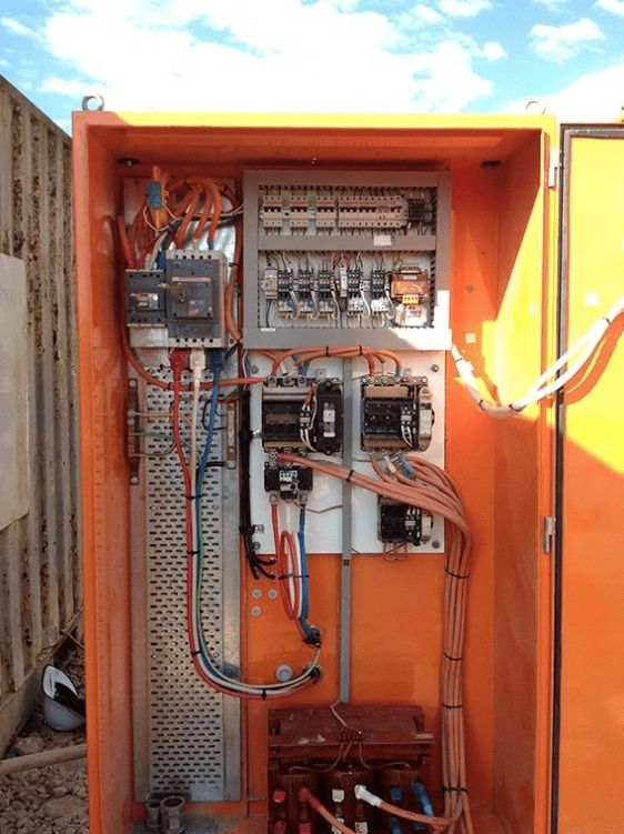 A Large Orange Electrical Box With a Lot of Wires Coming Out of It — Himec Electrical In Withcott, QLD
