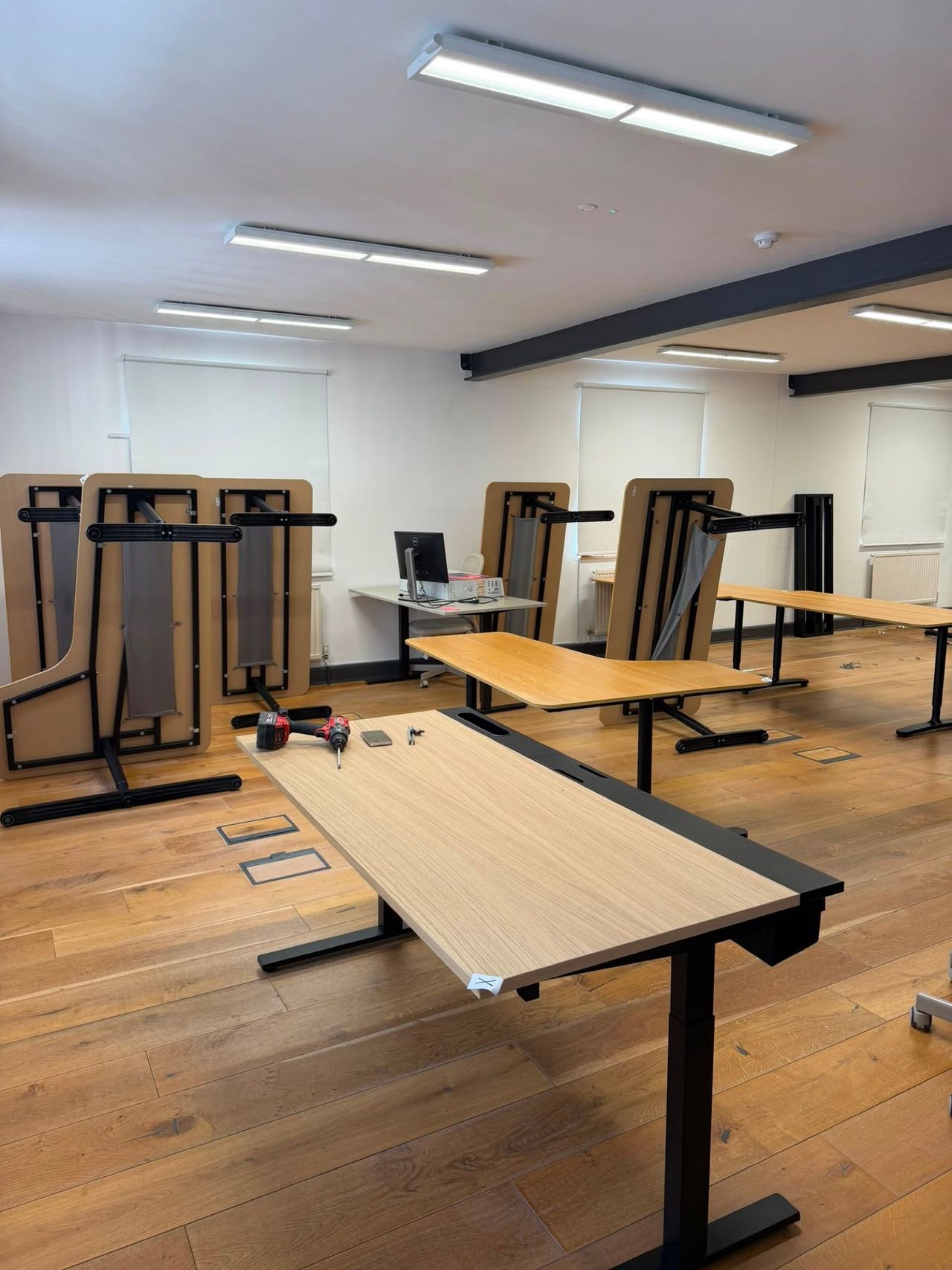 A small office with sit-stand desks before clearance