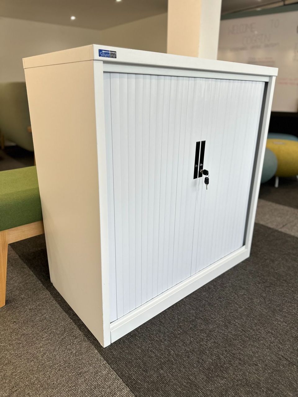 Refurbished white tambour cupboard in an office