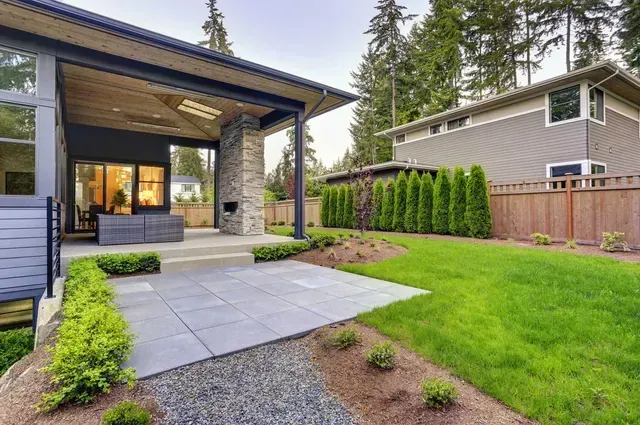 New modern home features a backyard with patio cover.