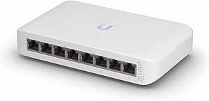 A white ethernet switch is sitting on a white surface.