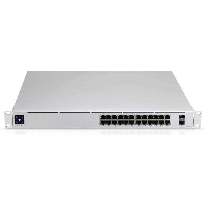 A white switch with a lot of ports on it on a white background.