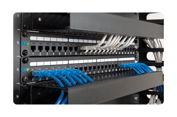 A server rack with a lot of wires hanging from it.