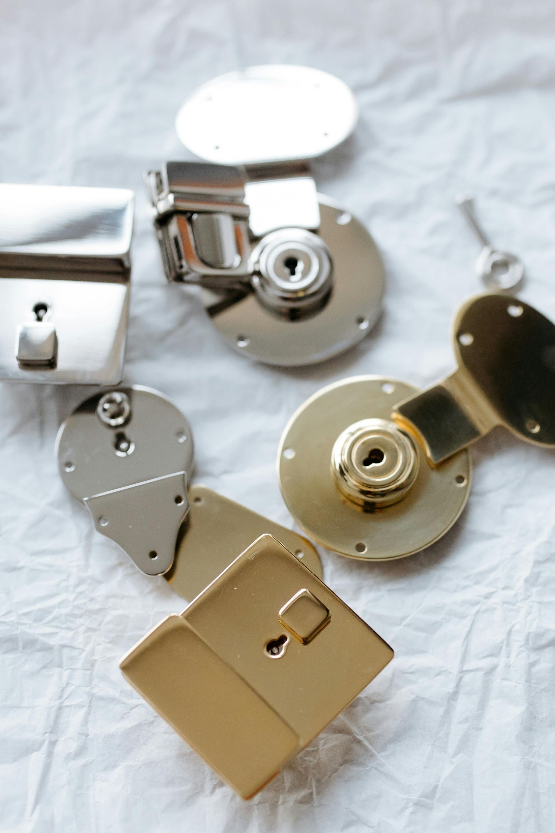 A bunch of different types of locks and keys on a table