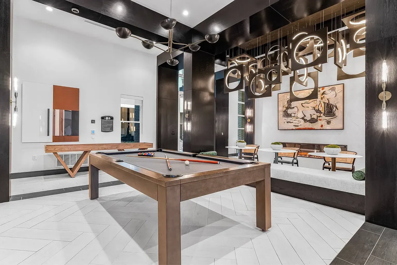Community lounge area with a pool table and seating.