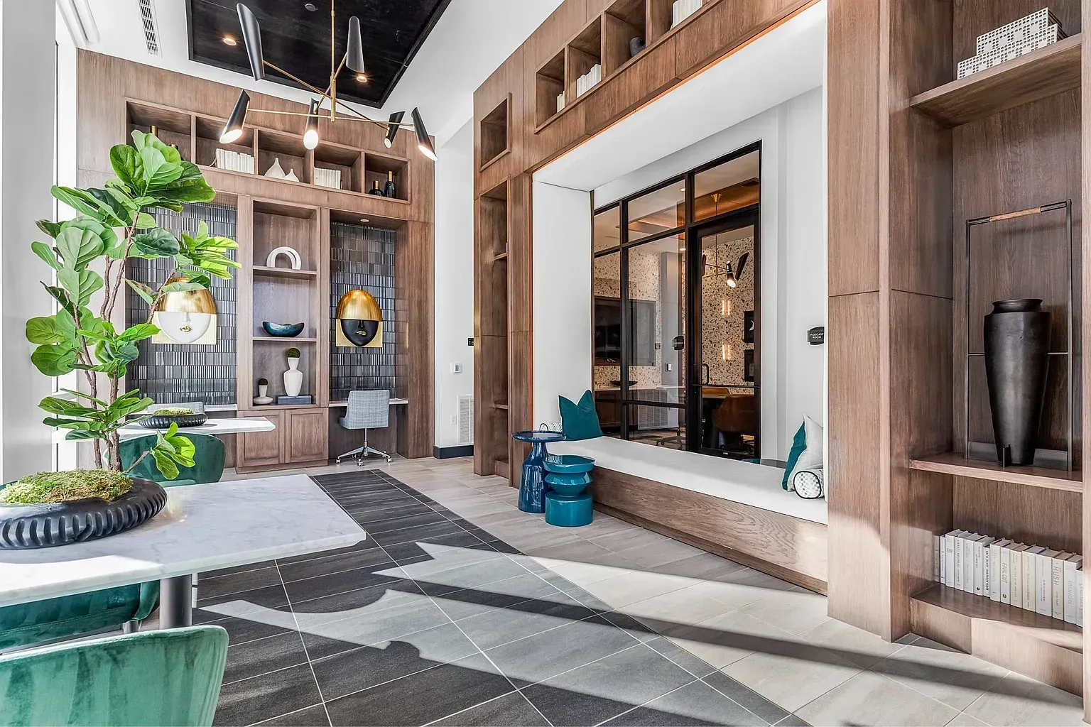 Modern lounge area with built-in bookshelves and a comfortable seating nook.