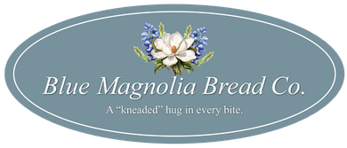 A blue oval logo for blue magnolia bread co.