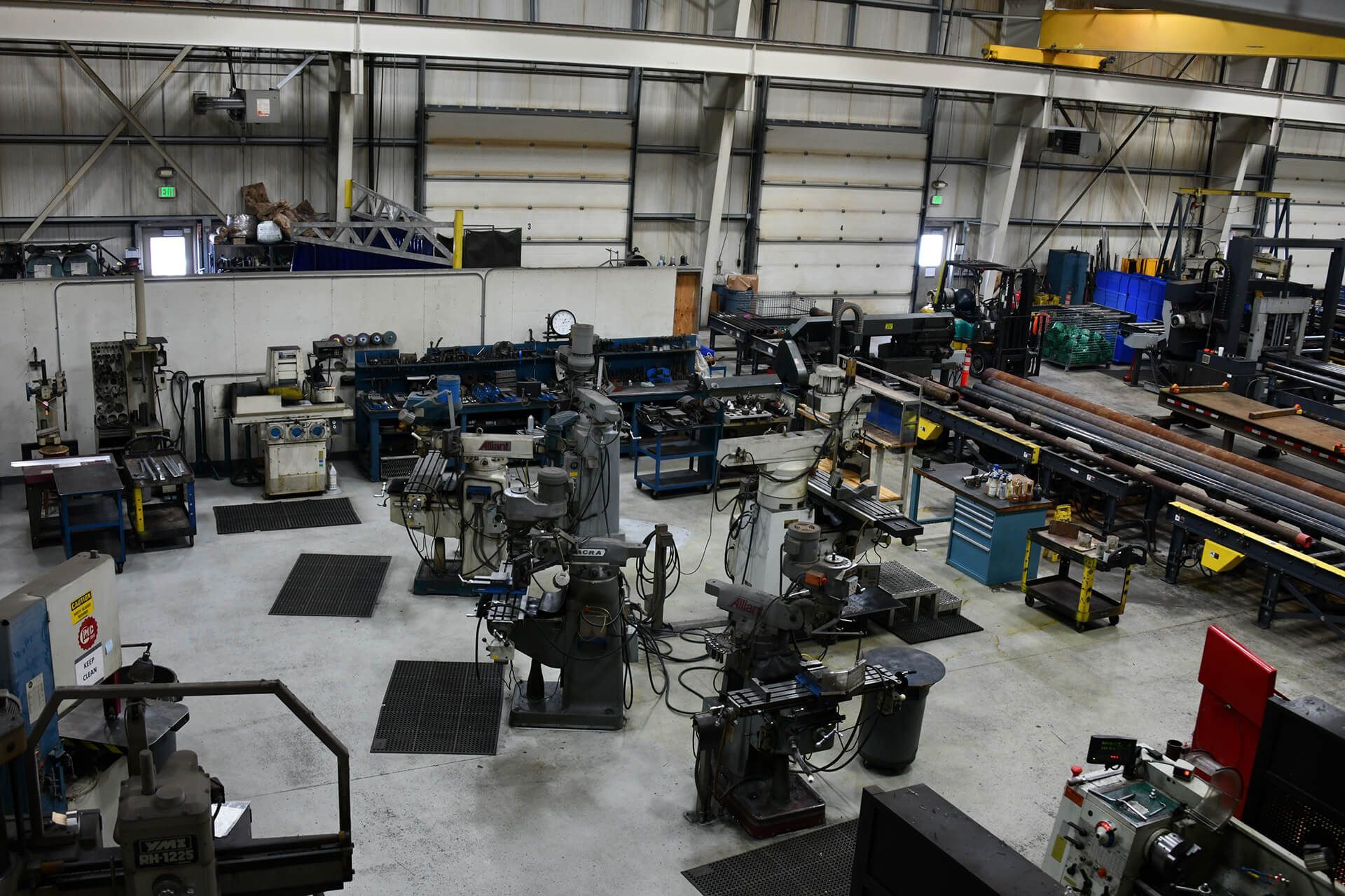 A large warehouse filled with lots of machines and machinery