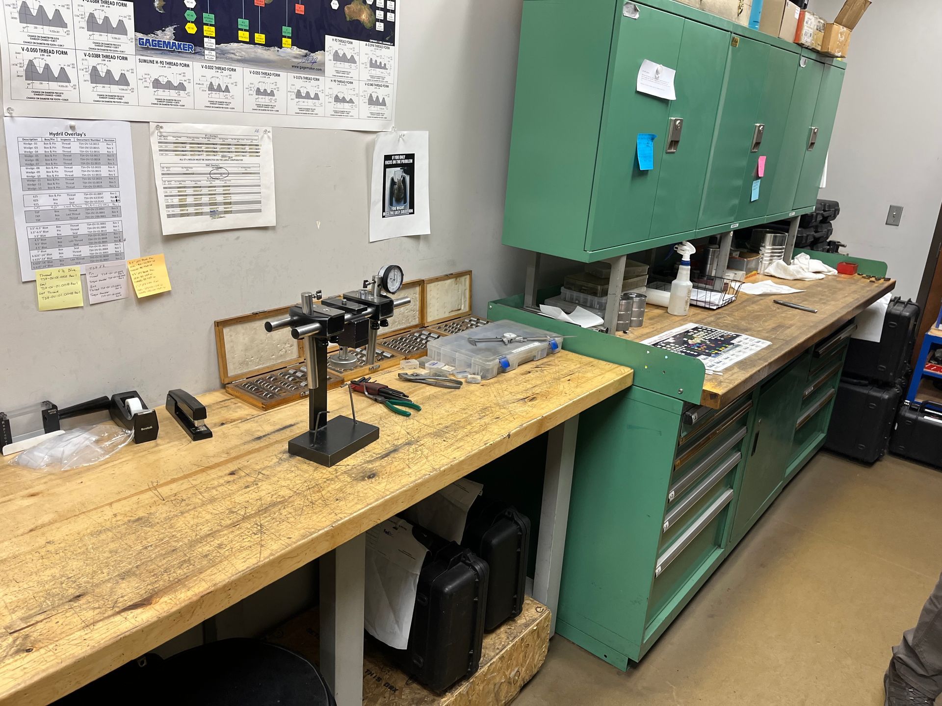 A workbench with a lot of tools on it in a room.