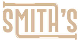 The logo for smith 's is a brown logo with a pipe in the middle.