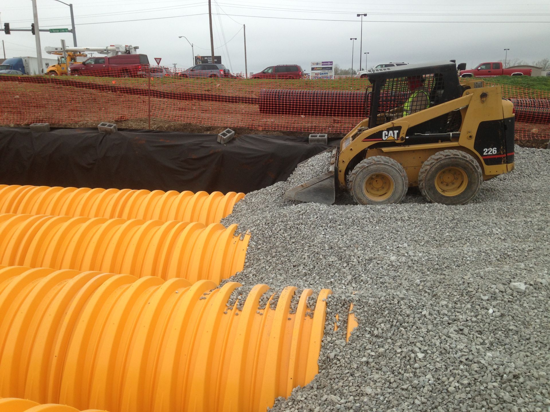 A construction site with a bulldozer that says cat on it