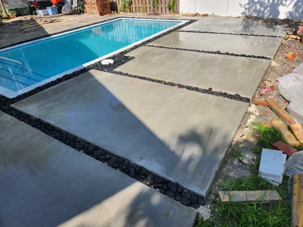 A swimming pool is being built in a backyard.