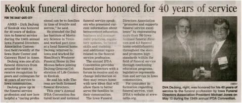 Newspaper article on Keokuk funeral director honored for 40 years of service, with two portrait photos