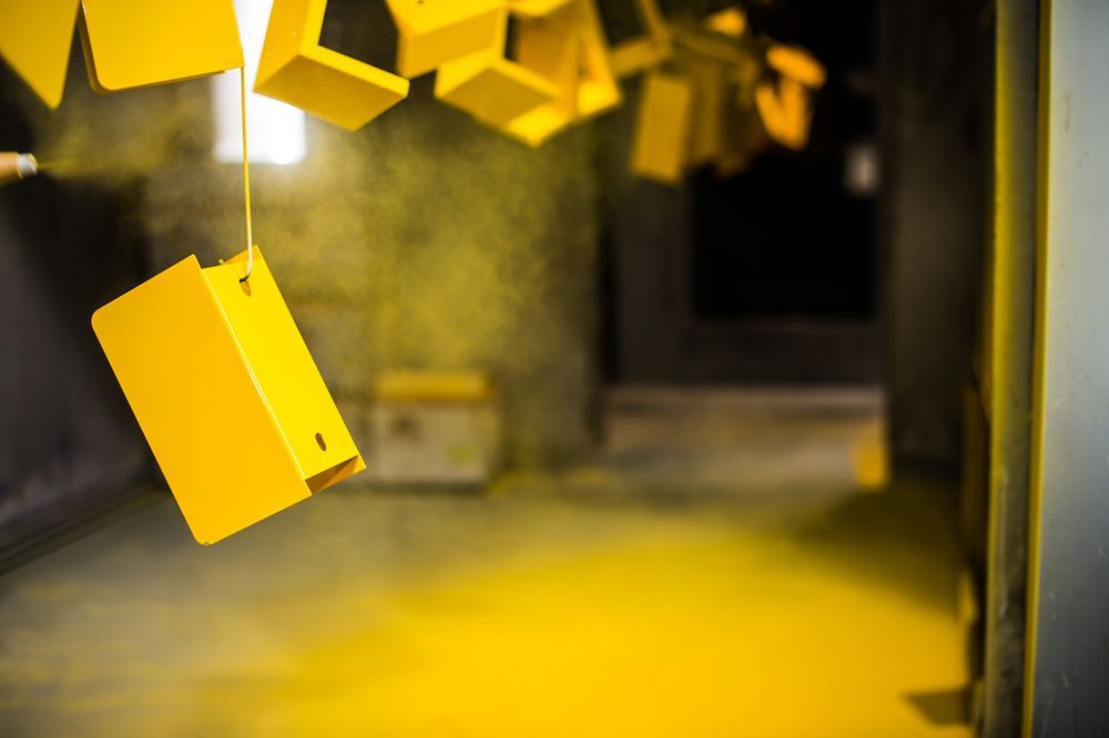 A Bunch of Yellow Squares Hanging From a Ceiling in a Room — Hastings Valley Powdercoaters in South West Rocks, NSW