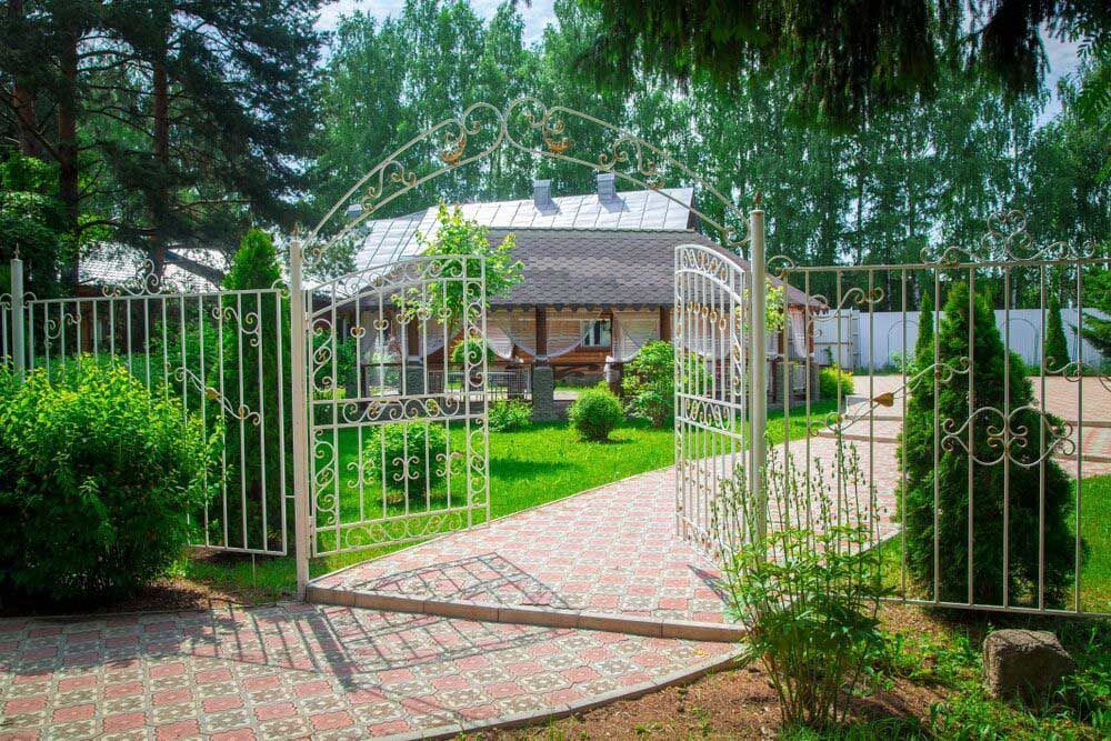 A Wrought Iron Gate Leading to a House in the Woods — Hastings Valley Powdercoaters in South West Rocks, NSW