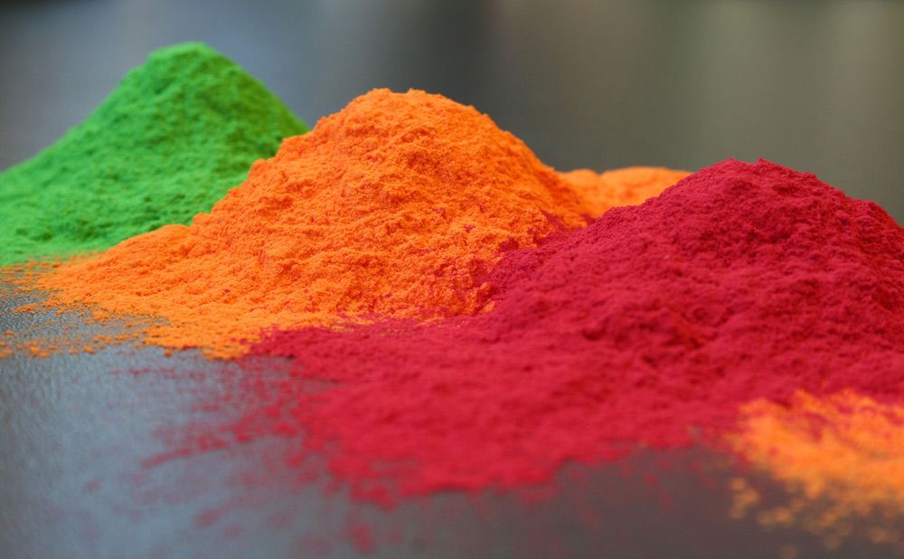 Three Piles of Different Coloured Powder Are Sitting on a Table — Hastings Valley Powdercoaters in Harrington, NSW