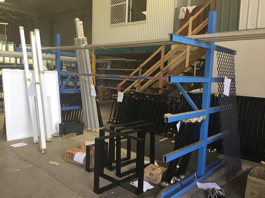 A Warehouse Filled With Lots of Pieces of Metal and Stairs — Hastings Valley Powdercoaters in Port Macquarie, NSW