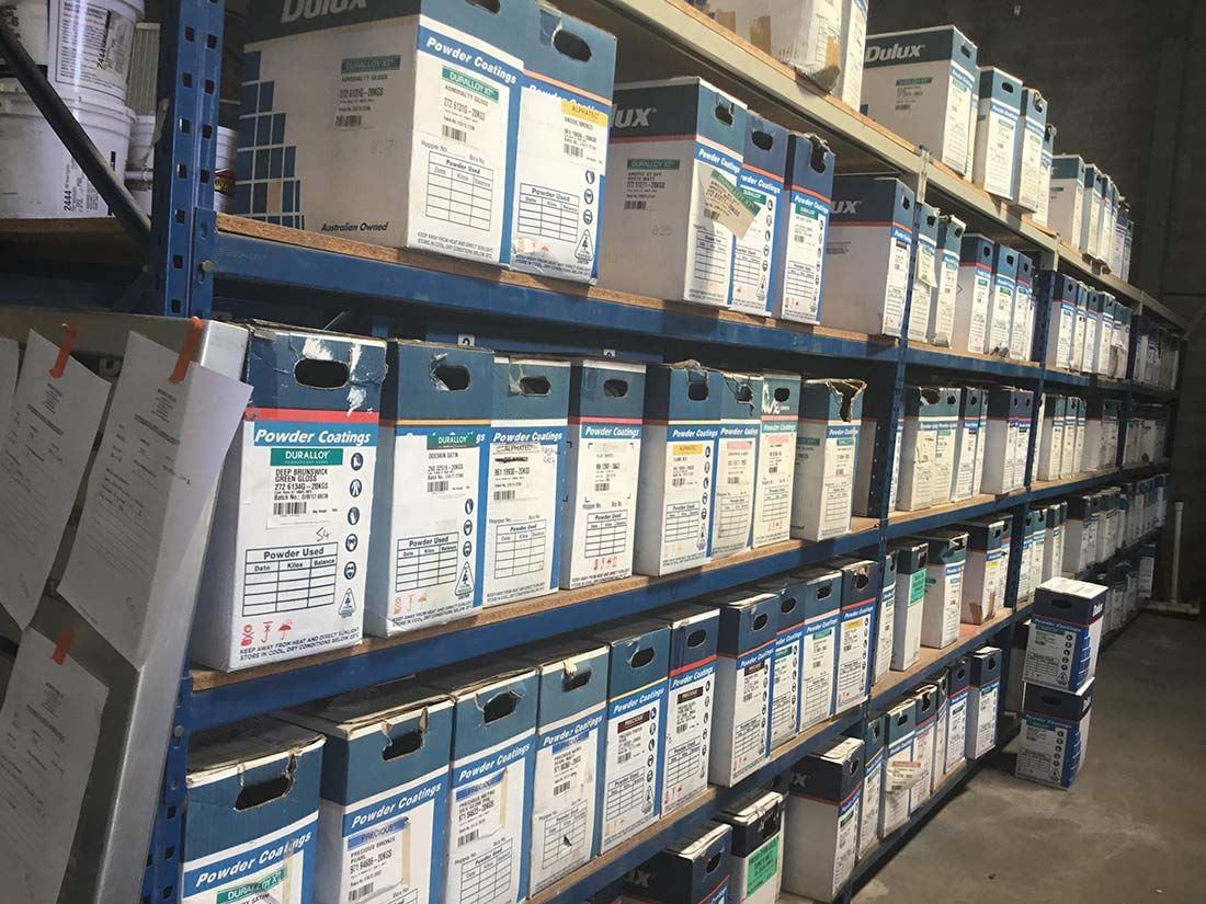 A Warehouse Filled With Lots of Blue and White Boxes — Hastings Valley Powdercoaters in Port Macquarie, NSW