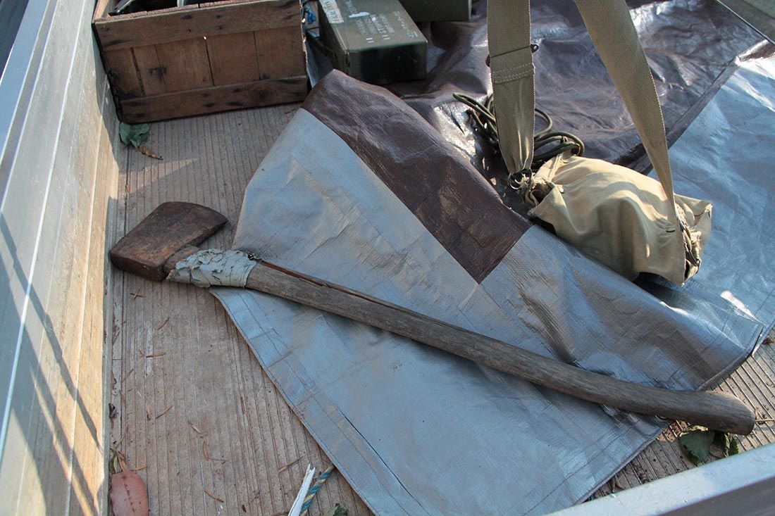 A Saw is Laying on a Piece of Tarp on the Ute Tray — Hastings Valley Powdercoaters in South West Rocks, NSW