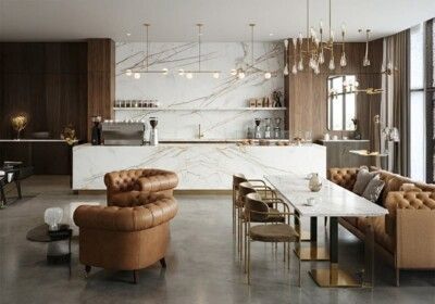 Modern cafe with marble counter, tan leather seating, and gold accents.