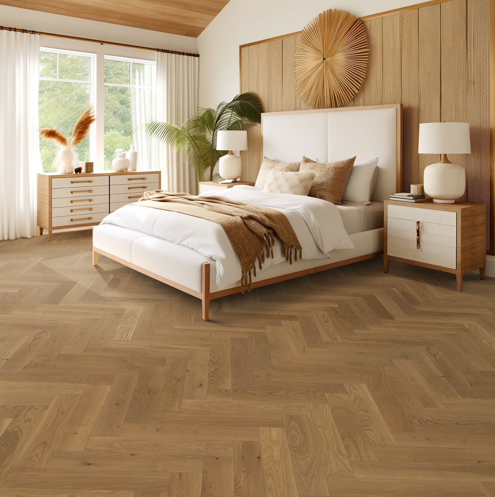 Bedroom with herringbone wood floor, white bed, natural accents, and sunny window.