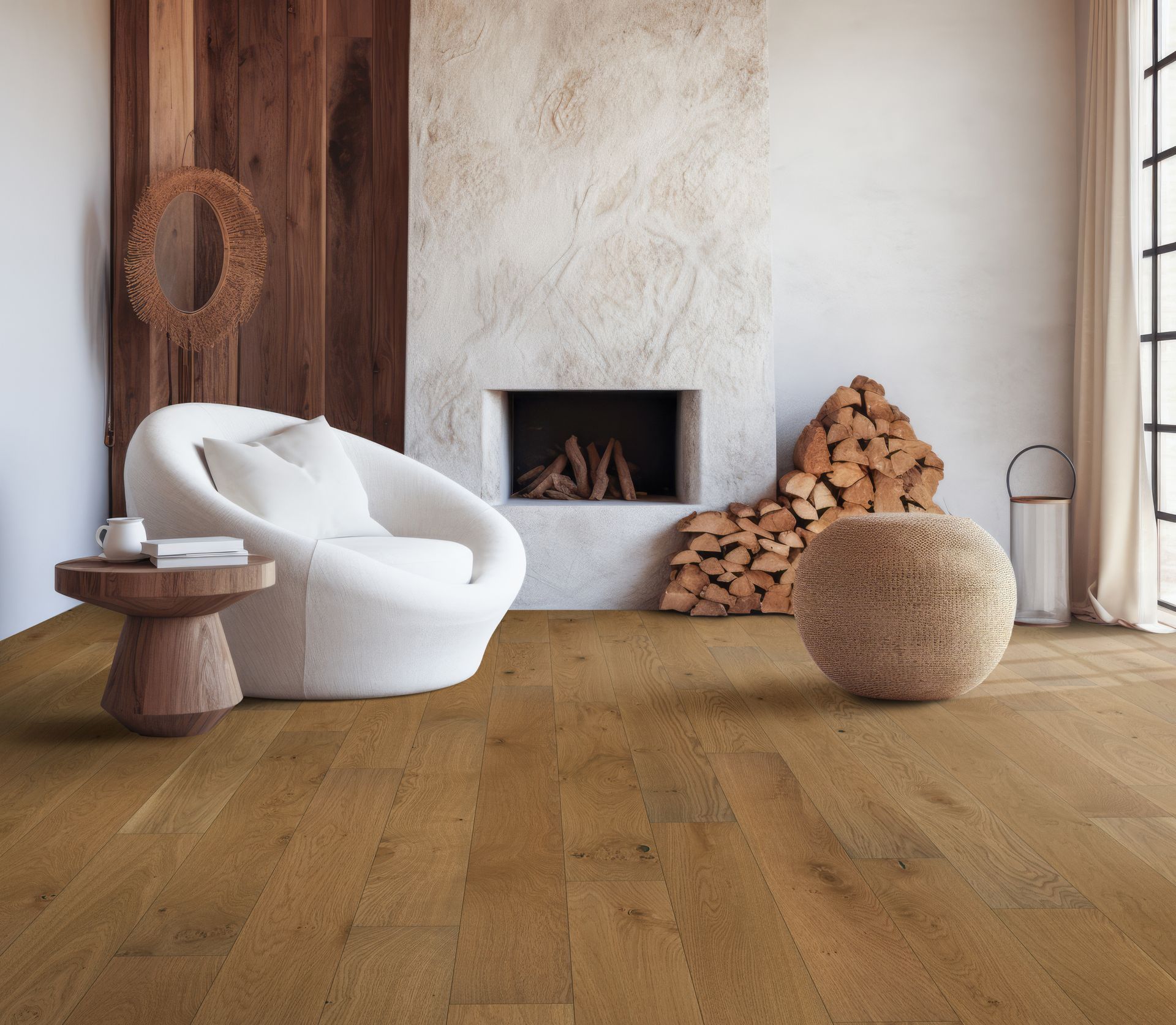 Cozy living room with white lounge chair, wood accents, fireplace, stacked firewood, and woven ottoman.