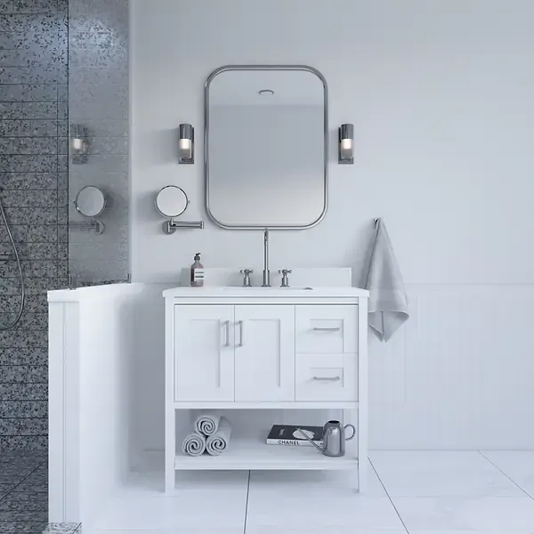 White bathroom vanity with mirror, sconces, towel, and accessories.