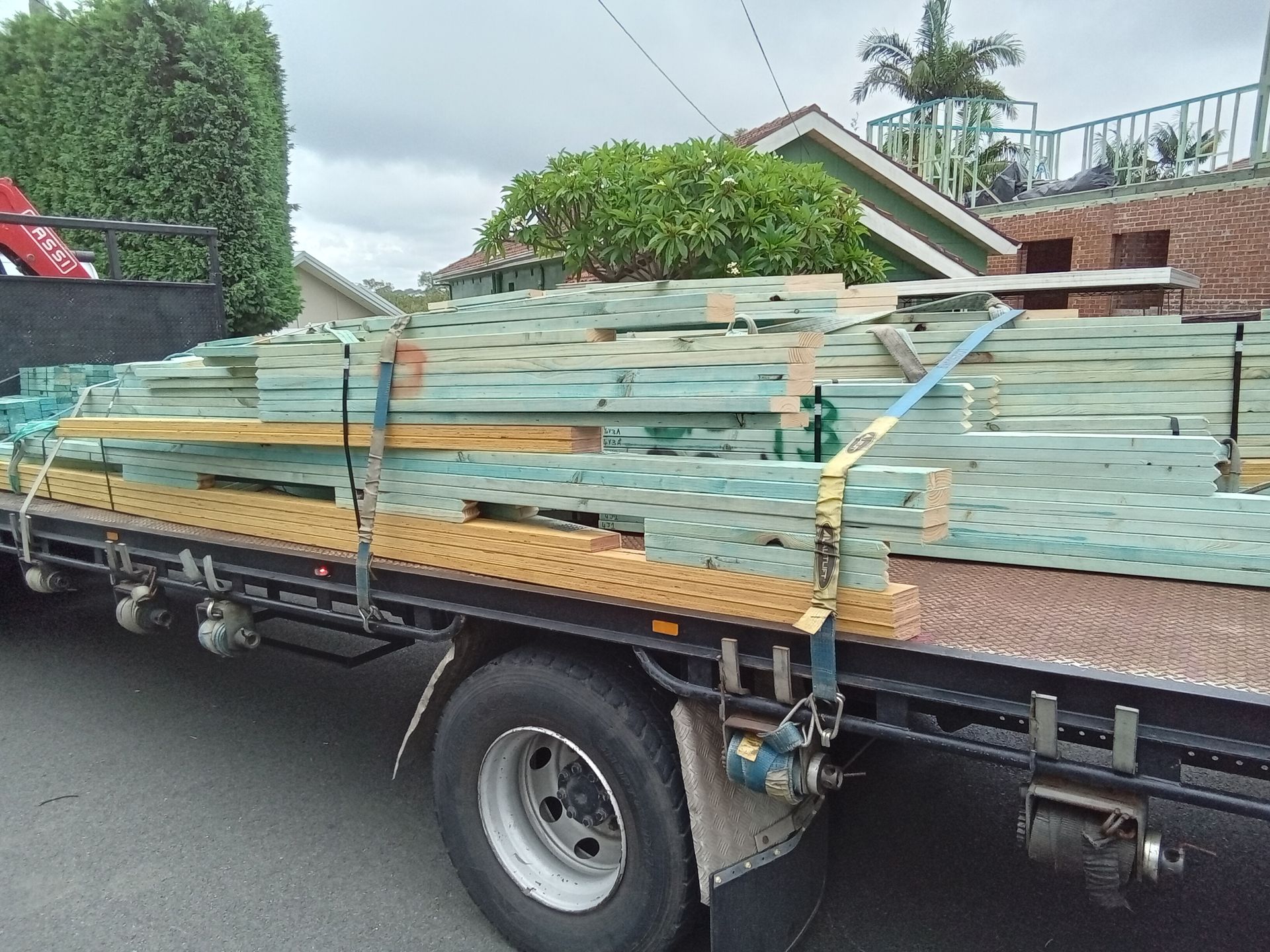 Prefabricated timber wall frames and roof trusses delivered to a residential building site in Cremorne, Sydney.