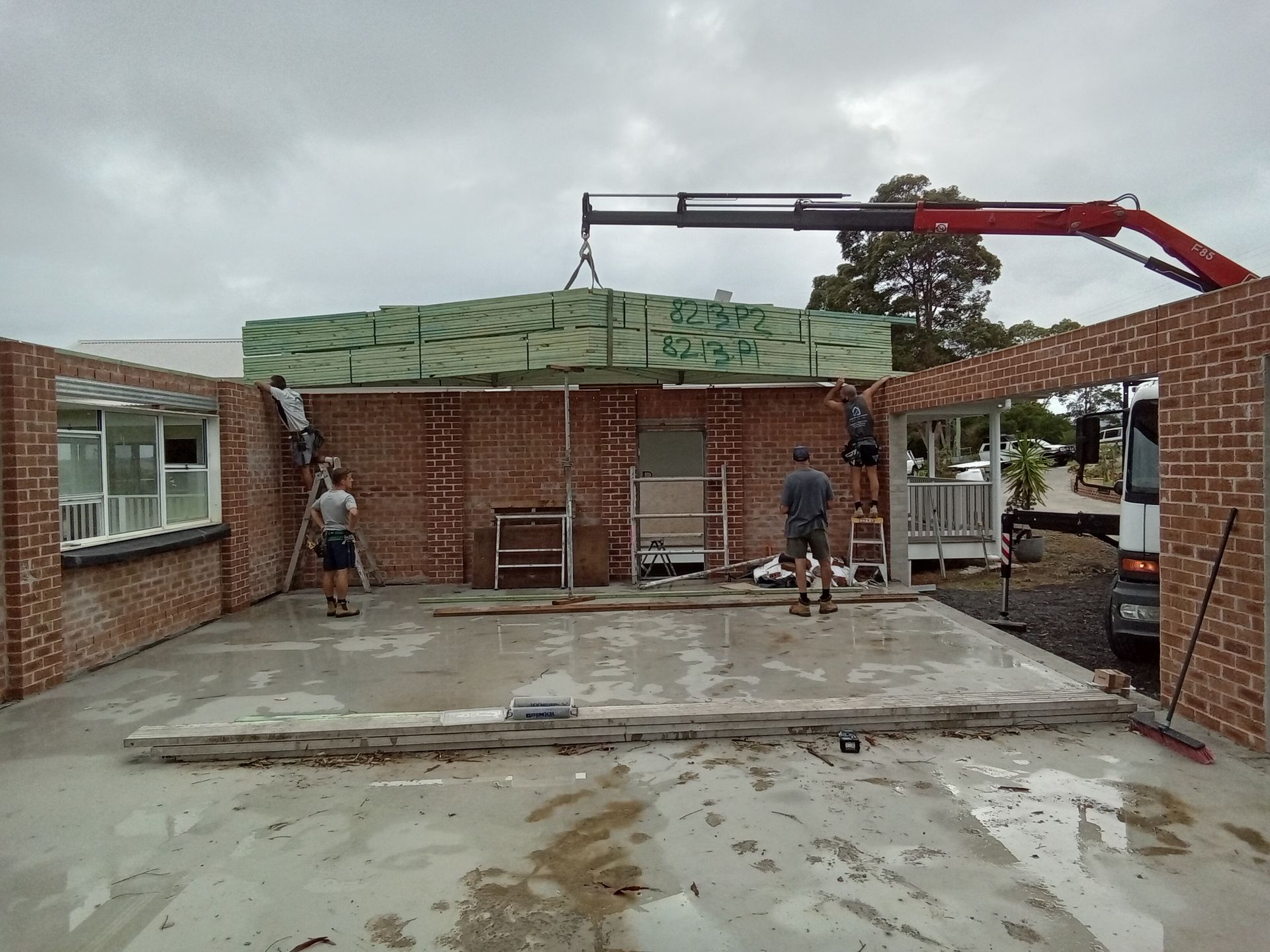Engineered timber roof trusses delivered and positioned for a residential building project in Jaspers Brush, Shoalhaven.